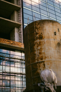 construction-worker-stands-large-concrete-structure-with-number-12-it (1)